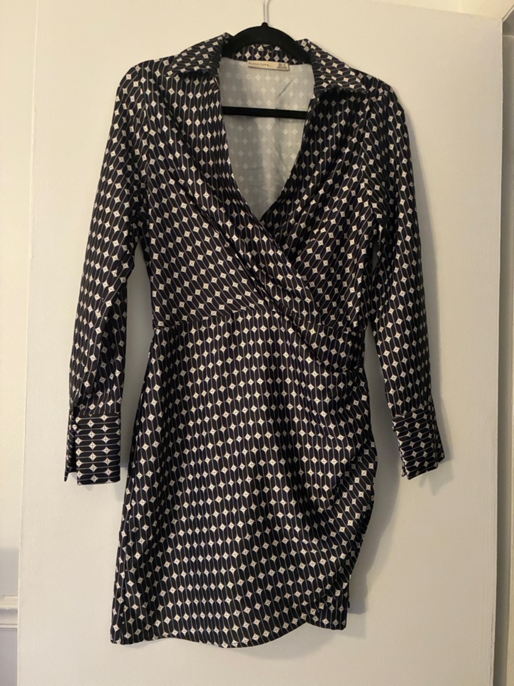 Black Tape_ Black and White Geometric Wrap Dress